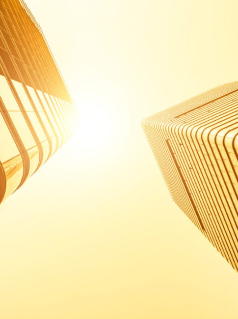 Bottom view of modern skyscrapers in business district in evenin Bottom view of modern skyscrapers in business district in evenin