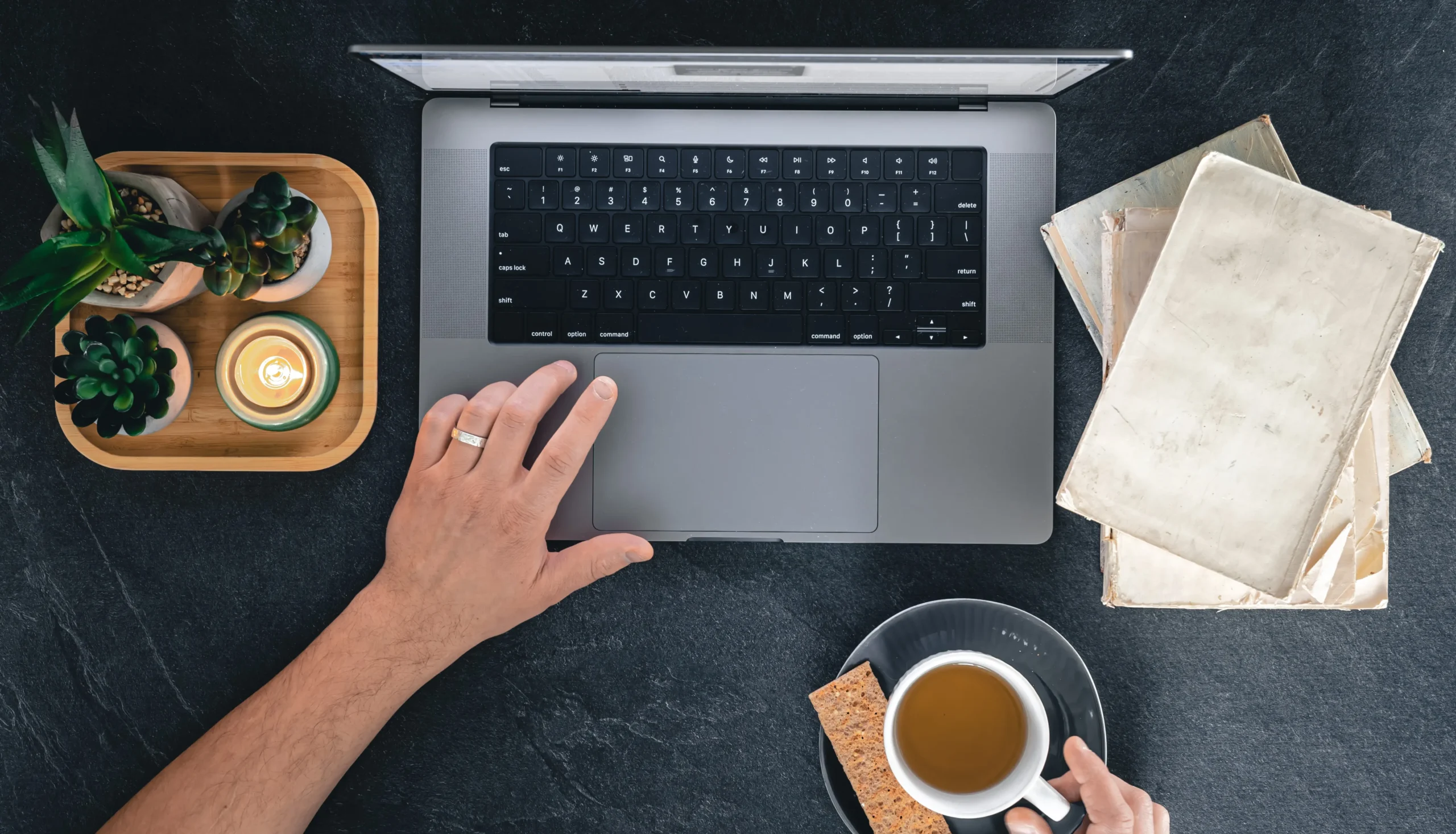 Workspace setup with a laptop, notebook, and coffee cup, showing a calm and simple working mood for learning digital marketing.