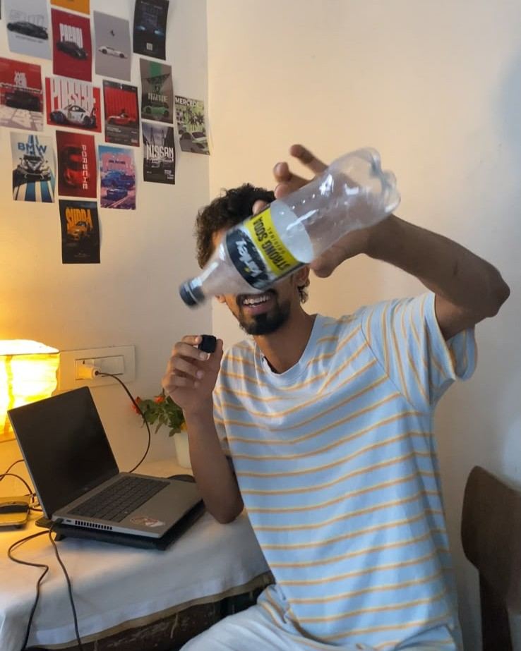 Gaznil holding a clear bottle before the AI milk effect